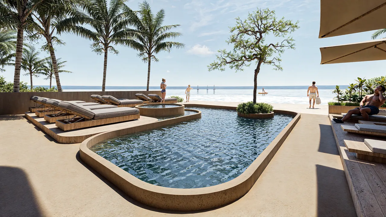 The beachfront pool with loungers and the Caribbean beyond