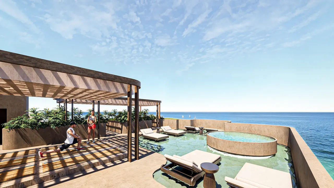 The rooftop by day, pergola shade and pool above the sea
